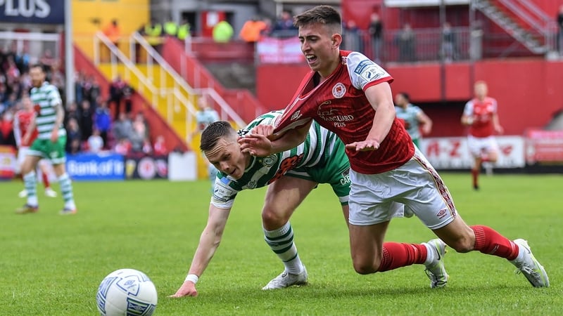 Darragh Burns is fouled by Andy Lyons during Monday's game between St Pat's and Shamrock Rovers