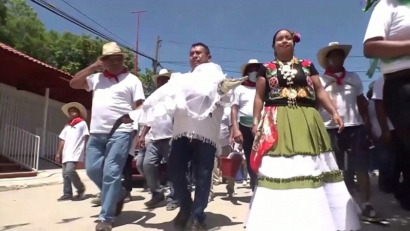 San Pedro Huamelula Mayor Victor Hugo Sosa heads to the wedding ceremony with his 'little princess' bride