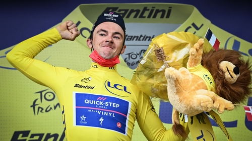 Yves Lampaert celebrates on the podium