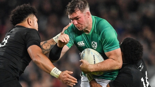 Peter O'Mahony is tackled by Ardie Savea and Sevu Reece