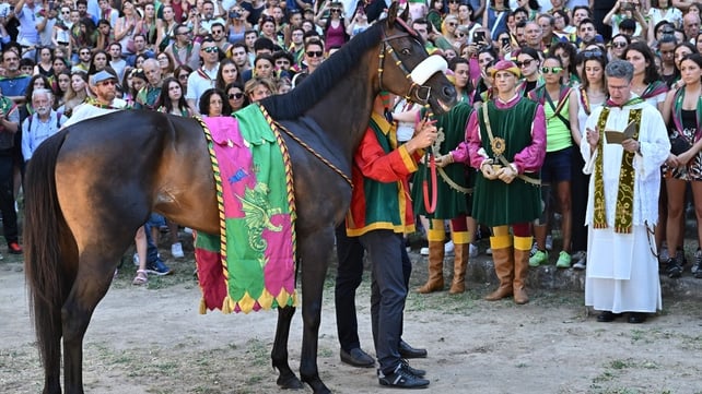 Atzeni and his horse Zio Frac receive a blessing at the Piazza del Campo square
