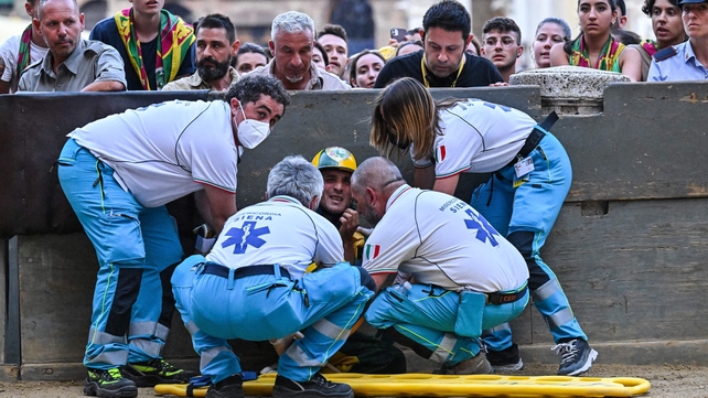 Medics treat an injured rider