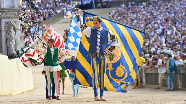 Riders represent their local district in the Tuscan city