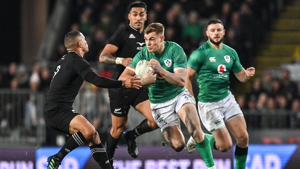 Garry Ringrose is tackled by Aaron Smith during the first test at Eden Park