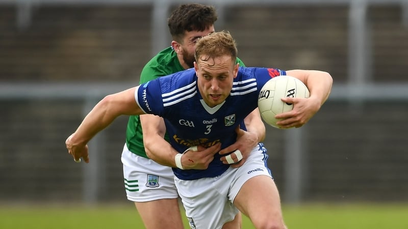 Cavan's Padraig Faulkner attempts to escape the clutches of Fermanagh's Ryan Jones during their Tailteann Cup quarter-final