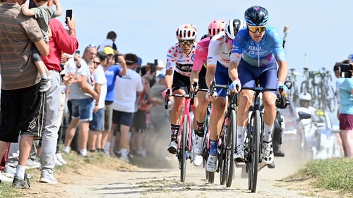 Simon Clarke leading the breakaway across one of the treacherous cobblestone sections