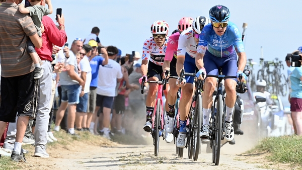 Simon Clarke leading the breakaway across one of the treacherous cobblestone sections