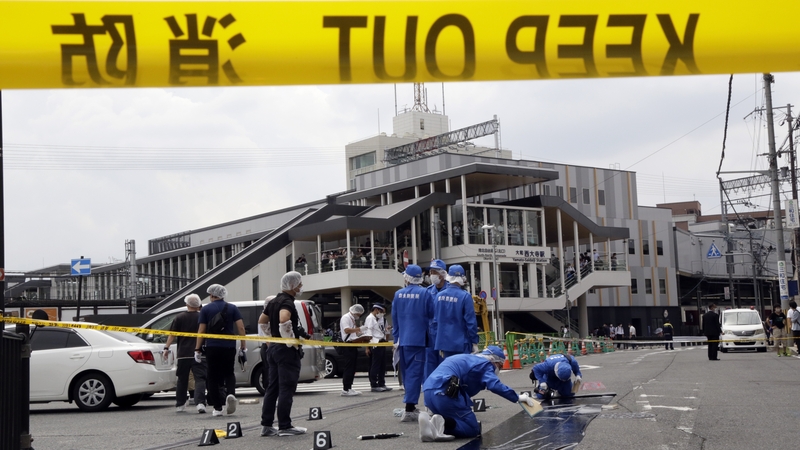 Police officers at the scene of the shooting in the Japanese city of Nara