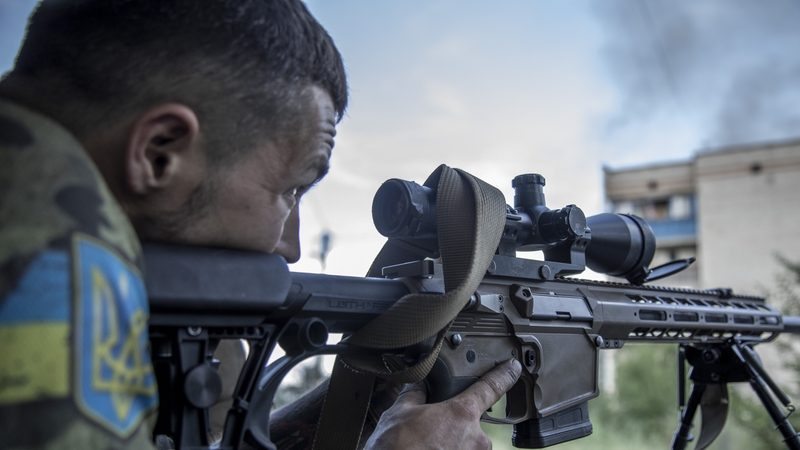 A Ukrainian soldier calibrates his sniper in Siversk