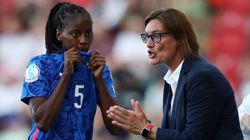 Corinne Diacre speaks with Aissatou Tounkara on the sideline during the opening group win