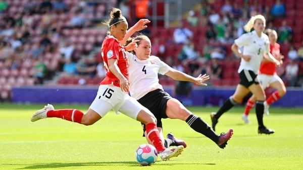 Austria's Nicole Billa (L) is tackled by Sarah McFadden of Northern Ireland