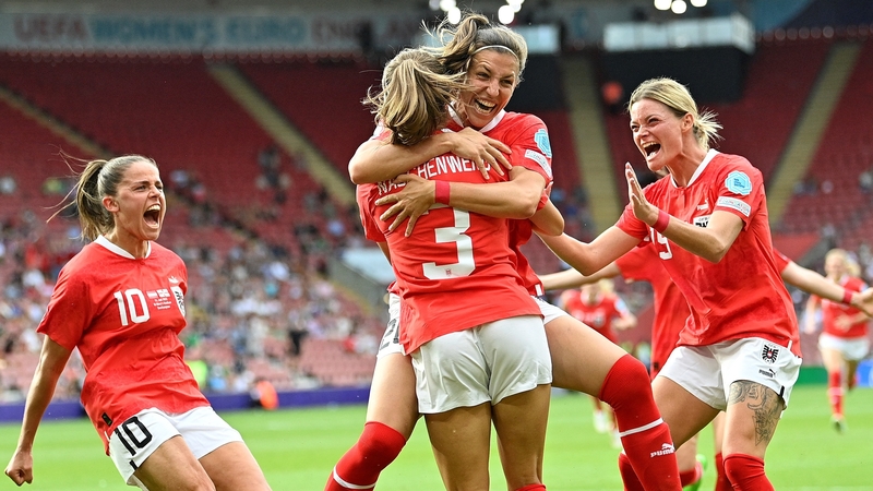 Austria's Katharina Naschenweng (C) is mobbed after her goal