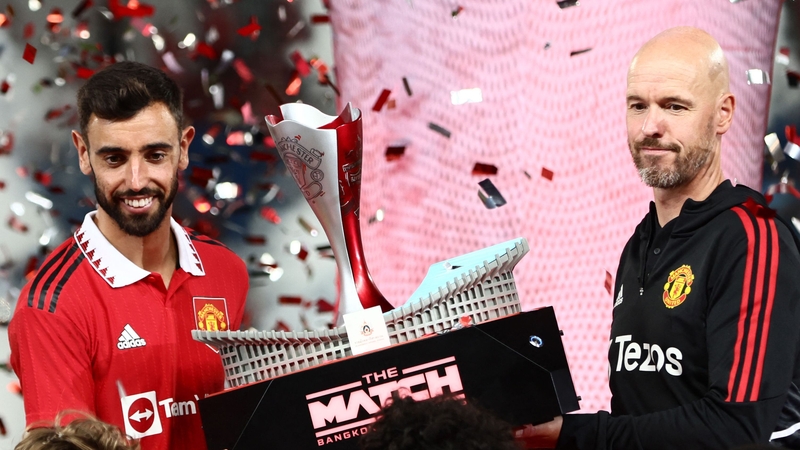 Manchester United captain Bruno Fernandes (L) and manager Erik Ten Hag were presented with a trophy after the friendly win