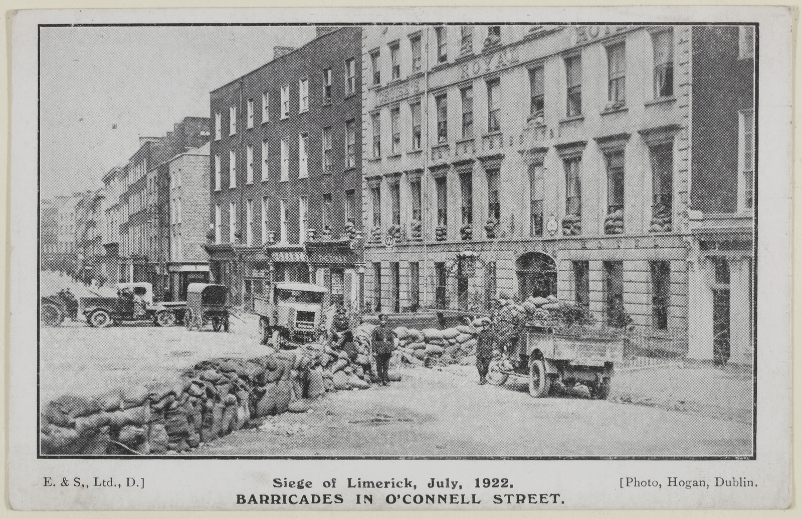 Postcard featuring a photograph taken by D. Hogan, depicting O'Connell Street, Limerick with barricades. Image courtesy of the National Library of Ireland
