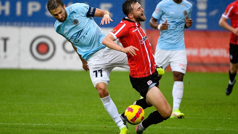 William Patching of Derry City in action against Yuri Kendysh