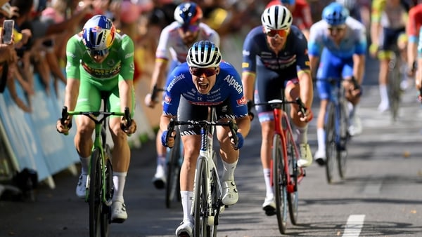 Jasper Philipsen (C) wins the stage into Carcassonne