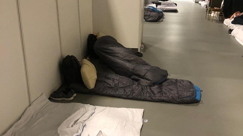 Photos shared on social media by the Abolish Direct Provision Campaign shows sleeping bags on floors in corridors