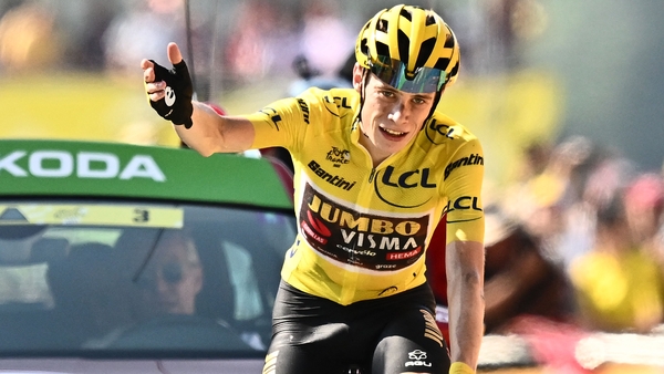Vingegaard celebrates as he cycles to the finish line
