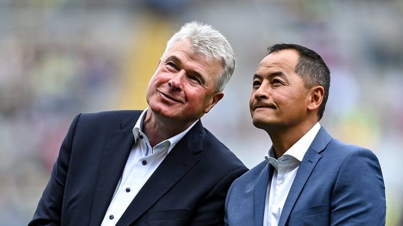 Jason Sherlock, with Charlie Redmond, yesterday in Croke Park as the 1995 Dublin All-Ireland winning team were celebrated