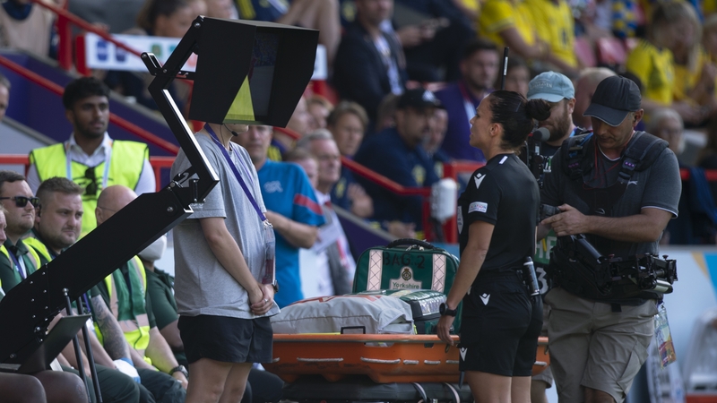 Referee Marta Huerta De Aza checks the pitch side VAR screen during the game between Sweden and Switzerland
