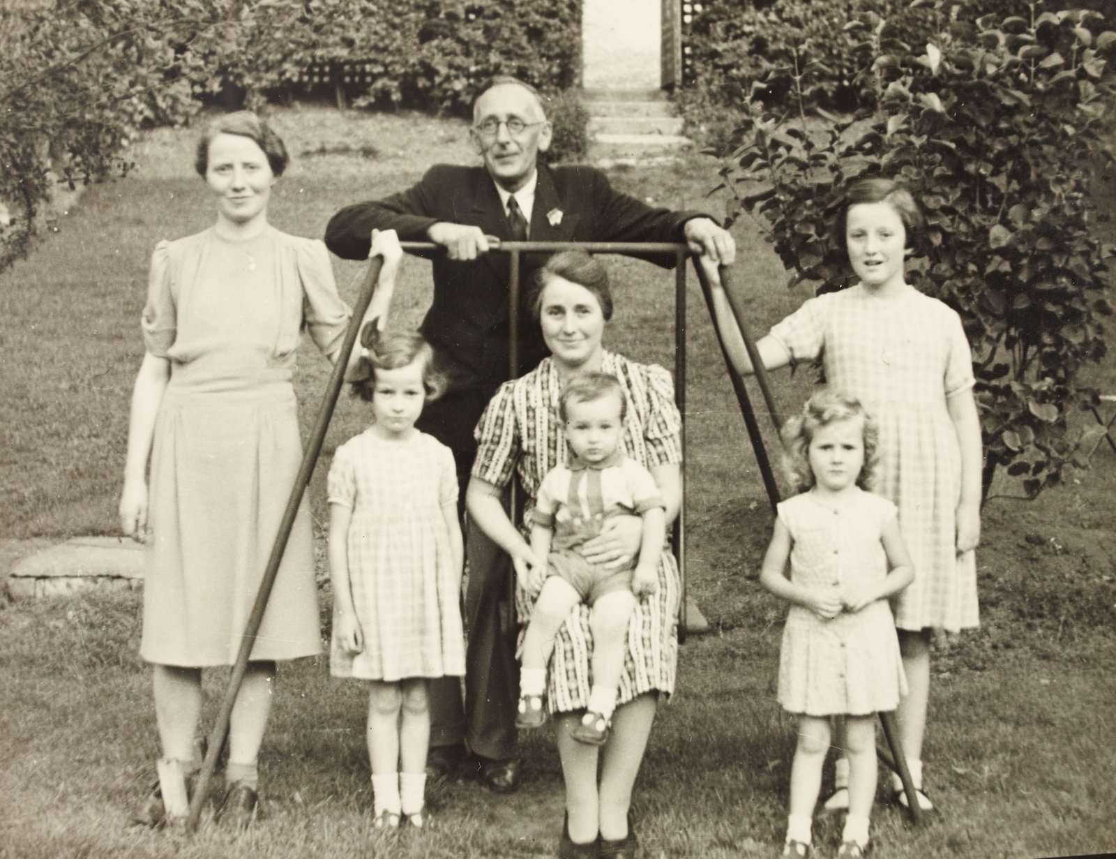 W.D Hogan photographed with an unidentified group of women and children. Image courtesy of the  National Library of Ireland