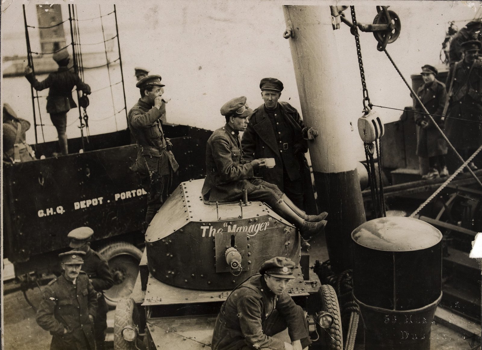 Troops sitting on military vehicles on board the "Lady Wicklow", taking refreshments. Image courtesy of the National Library of Ireland