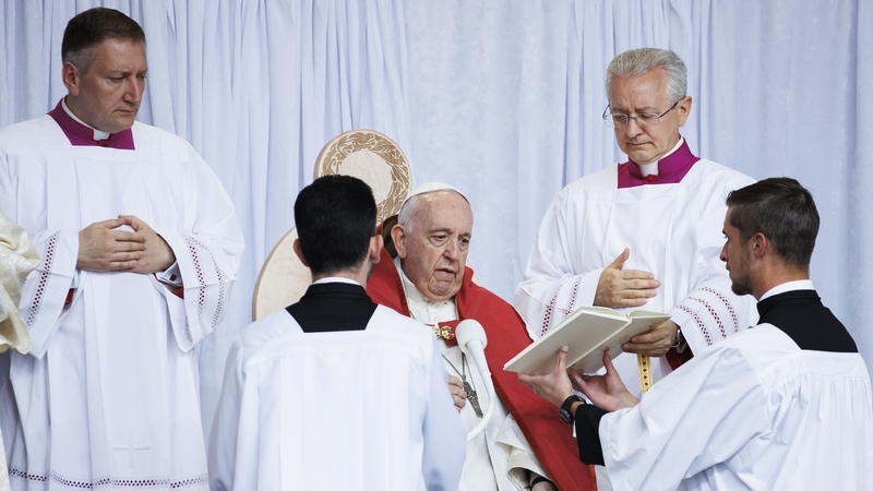 Pope Francis reads during his open-air mass at Commonwealth Stadium today in Edmonton, Canada