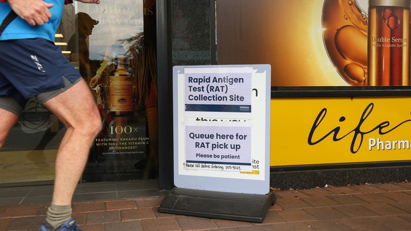 A sign outside a pharmacy in Christchurch directs the public to where they can pick up free Rapid Antigen Tests