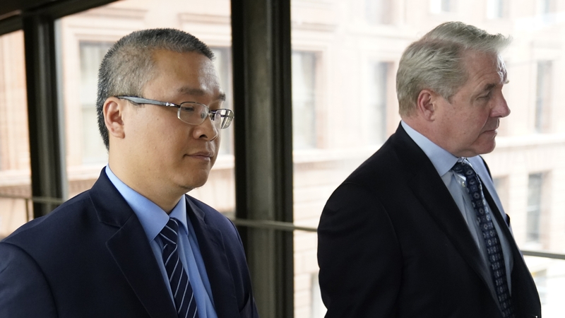 Former Minneapolis police officer Tou Thao, left, and his attorney Robert Paule arrive for sentencing