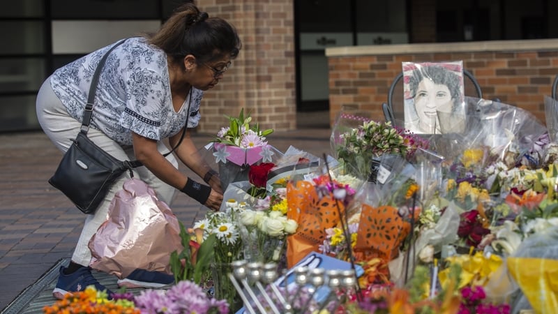 A memorial near where police say the accused opened fire on a crowd during a Fourth of July parade