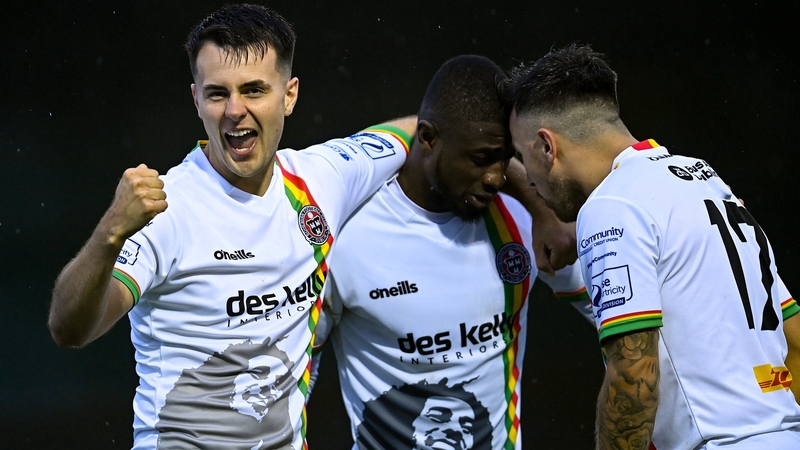 Junior Ogedi Uzokwe (centre), is congratulated by teammates Josh Kerr (L) and John O'Sullivan