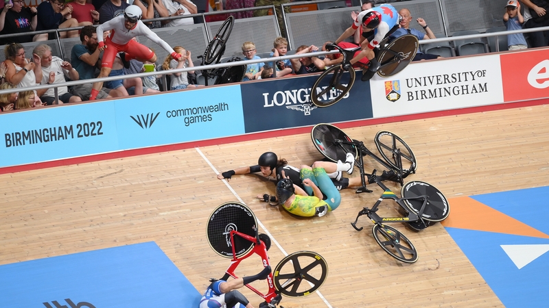 Matt Walls of England (left) crashes over the rail during a crash with George Jackson of New Zealand and Joshua Duffy of Australia (centre)