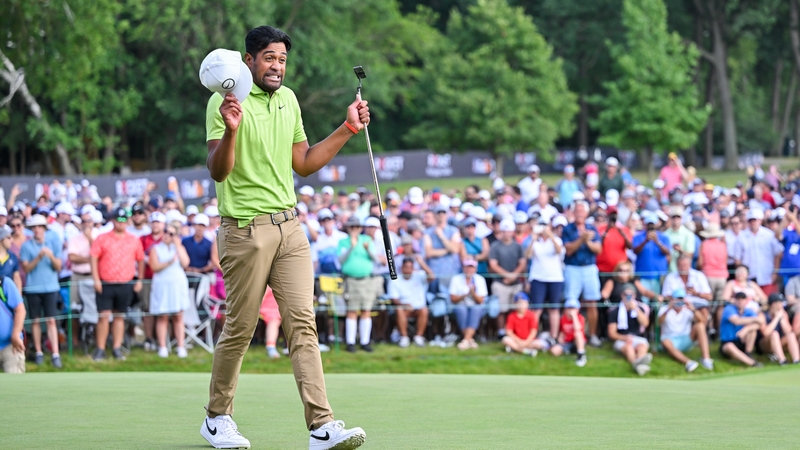 Tony Finau celebrates on the 18th green