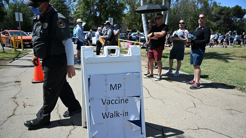 People wait in line to receive the monkeypox vaccine at the Balboa Sports Center in the Encino neighbourhood of Los Angeles