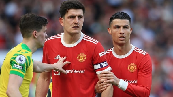 Harry Maguire (L) and Cristiano Ronaldo