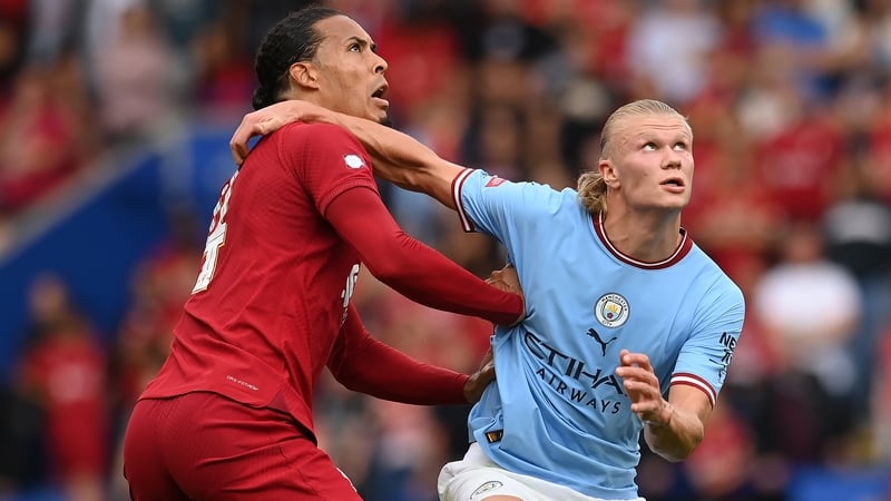 Virgil van Dijk (L) and Erling Haaland will cross paths at Anfield on Sunday