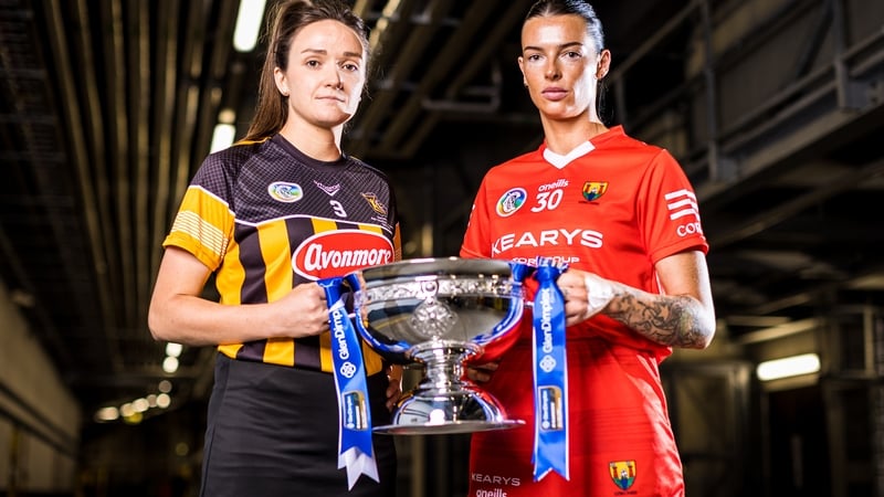Kilkenny's Claire Phelan (L) and Ashling Thompson of Cork pictured with the O'Duffy Cup