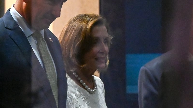 Nancy Pelosi leaves the Shangri-La Hotel following a reception at the American Chamber of Commerce in Singapore