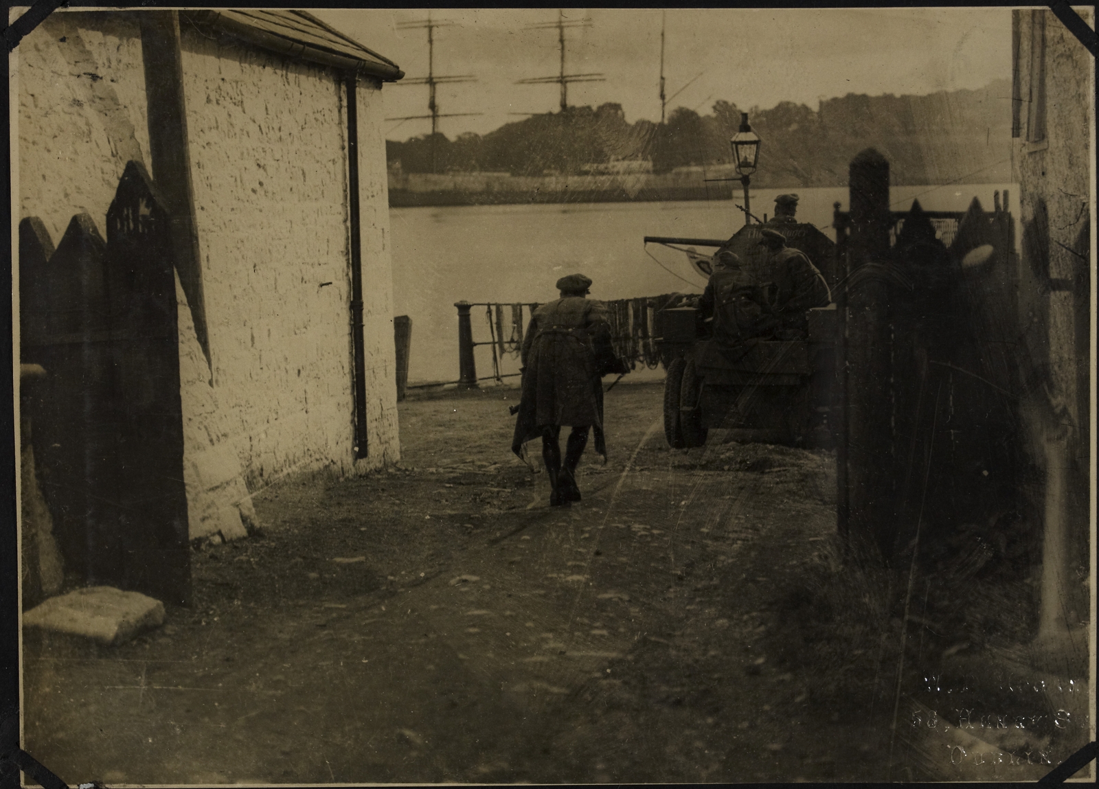 National Army troops patrolling streets in Passage West, trying to locate snipers. Image courtesy of the National Library of Ireland