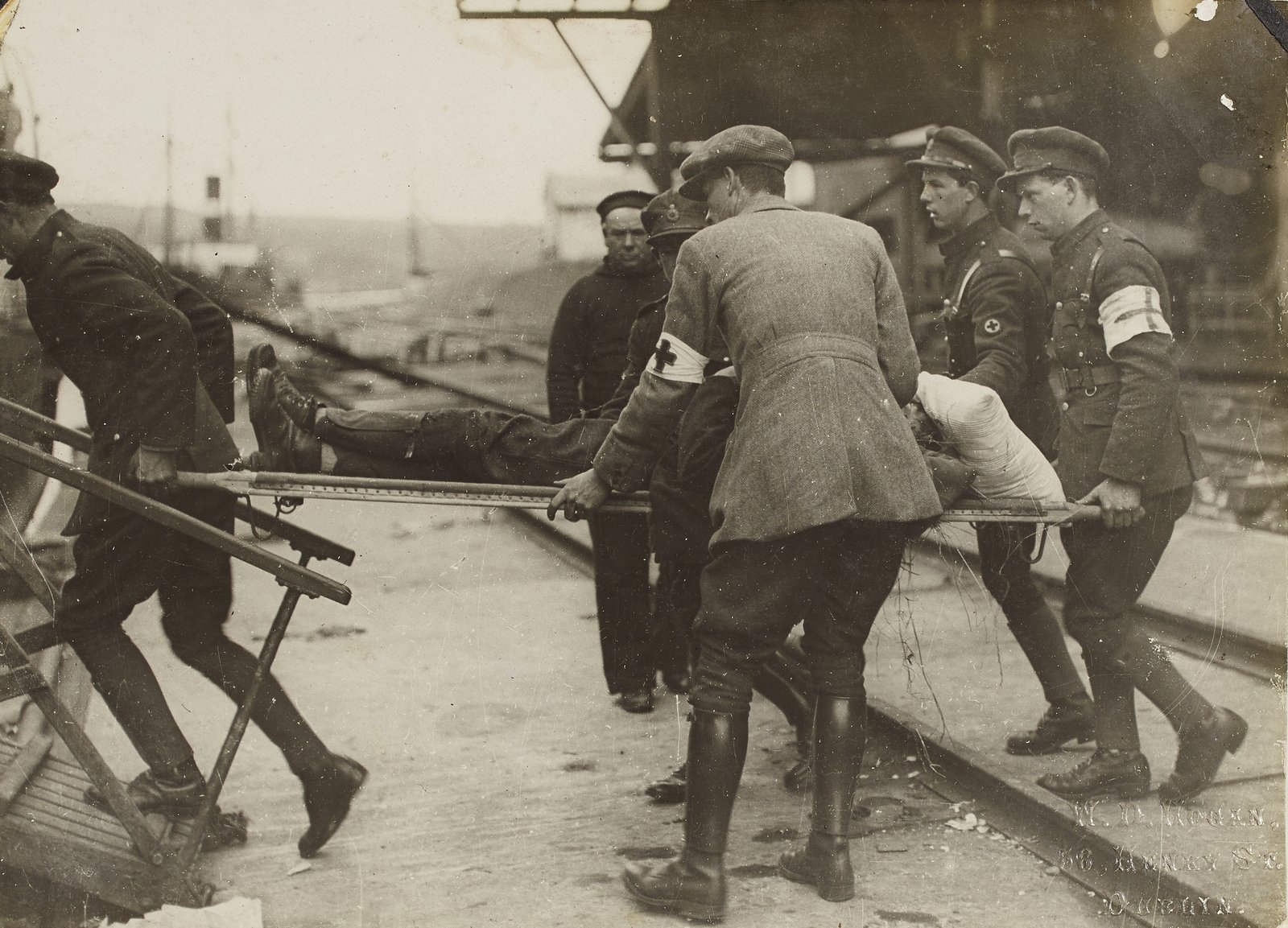 Members of the National Army medical corps taking one of the wounded back to the Lady Wicklow which formed the base hospital until the troops had advanced from Passage West to Cork City. Image courtesy of the National Library of Ireland