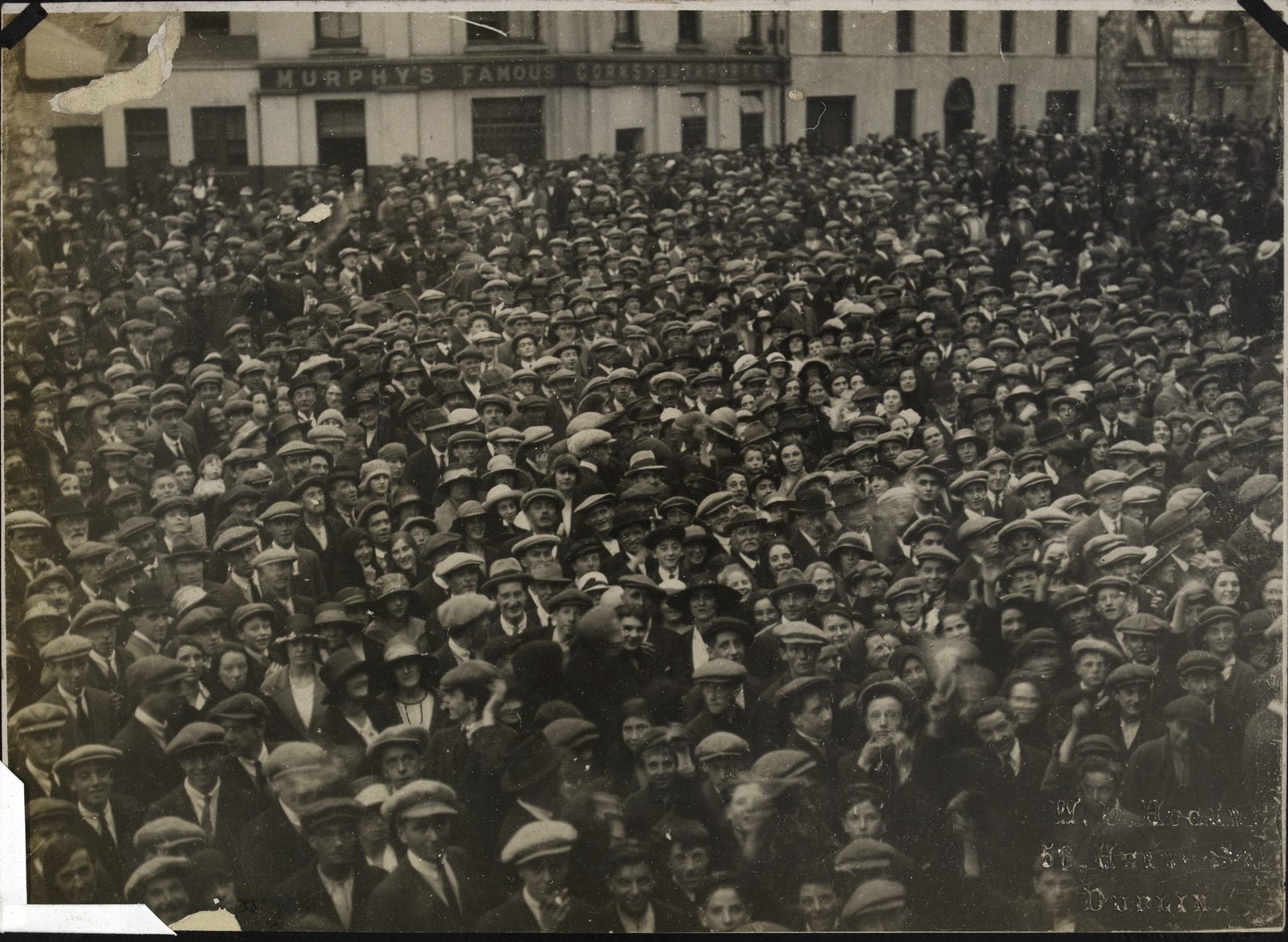 Crowds in Cork city welcome National Army troops after their arrival. National Library of Ireland