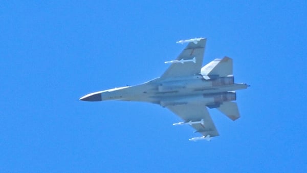 A Chinese military jet flies over Pingtan island, one of mainland China's closest points from Taiwan, in Fujian province
