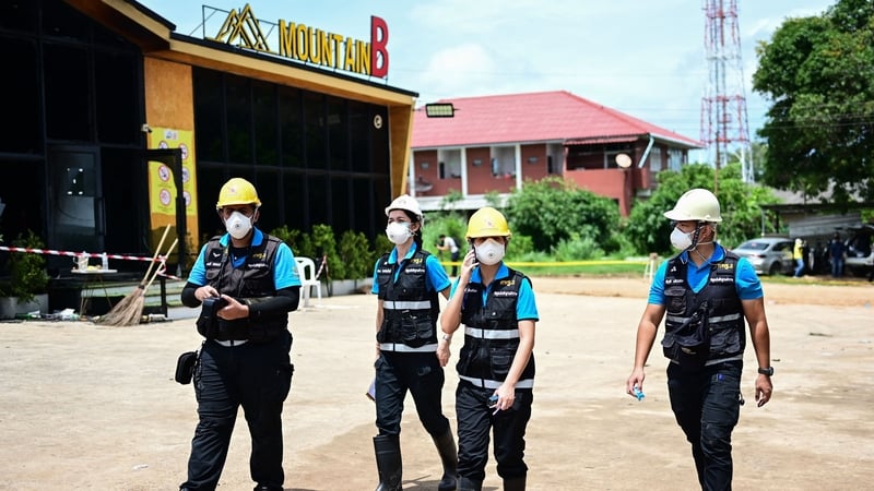 Forensic police work at the Mountain B nightclub after a fire killed 13