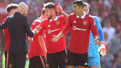 Erik ten Hag (L) chats with Christiano Ronaldo (R) during Sunday's friendly with Rayo Vallecano