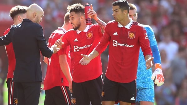 Erik ten Hag (L) chats with Christiano Ronaldo (R) during Sunday's friendly with Rayo Vallecano