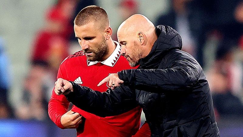 Manchester United manager Erik ten Hag (R) speaks with Luke Shaw during friendly last month