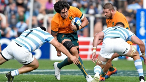 Australia's Darcy Swain (C) is tackled
