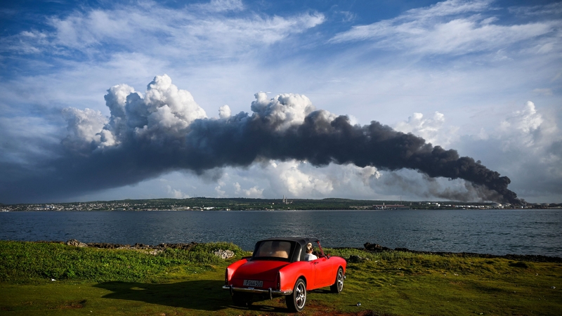 A lightning strike on Friday ignited one of eight storage tanks