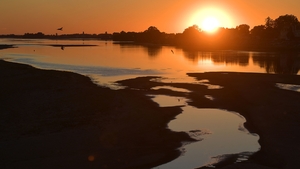 Sandbanks are visible as water levels fall on the Loire river in western France. France is experiencing a drought exacerbated by a third extreme heatwave this summer