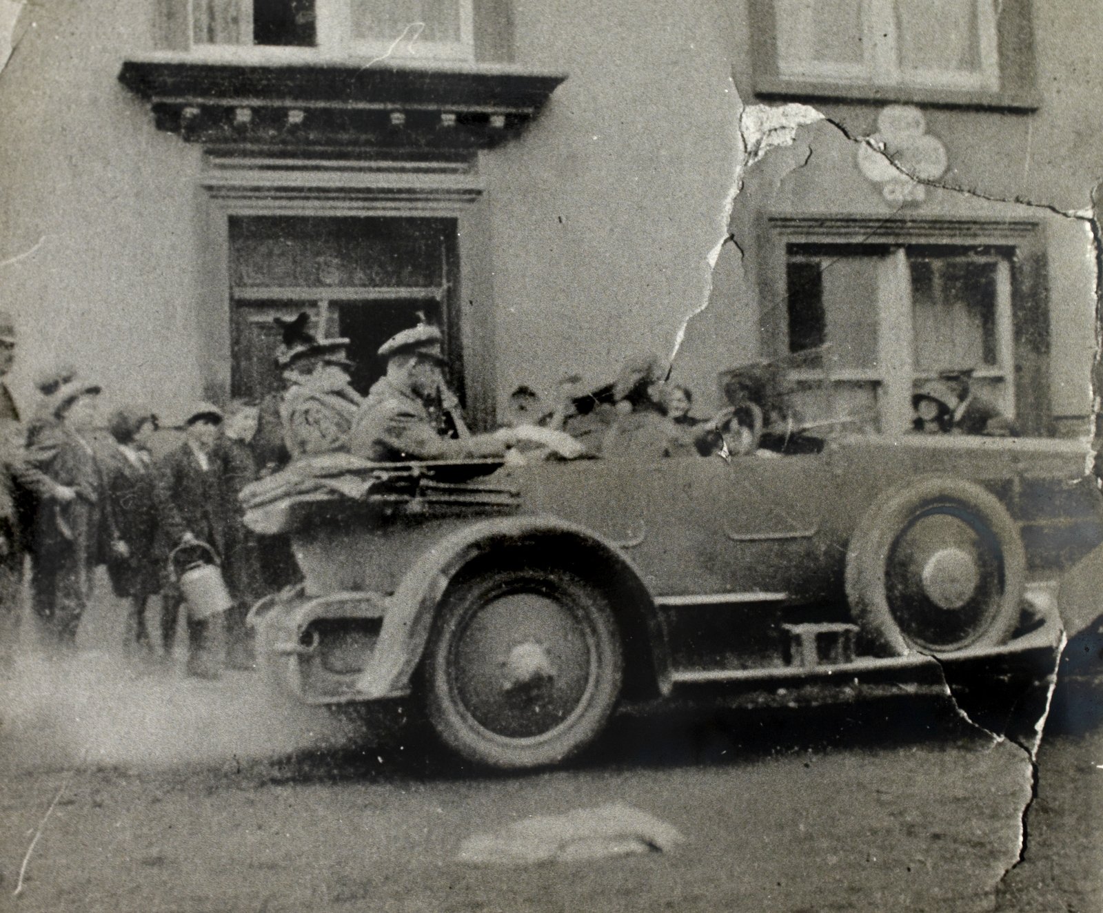 THE LAST PHOTOGRAPH: Thirty minutes before the ambush, local girl Agnes Hurley snatched this image on her Box Brownie camera, as the convoy prepared to leave Bandon (Pic: National Museum of Ireland)